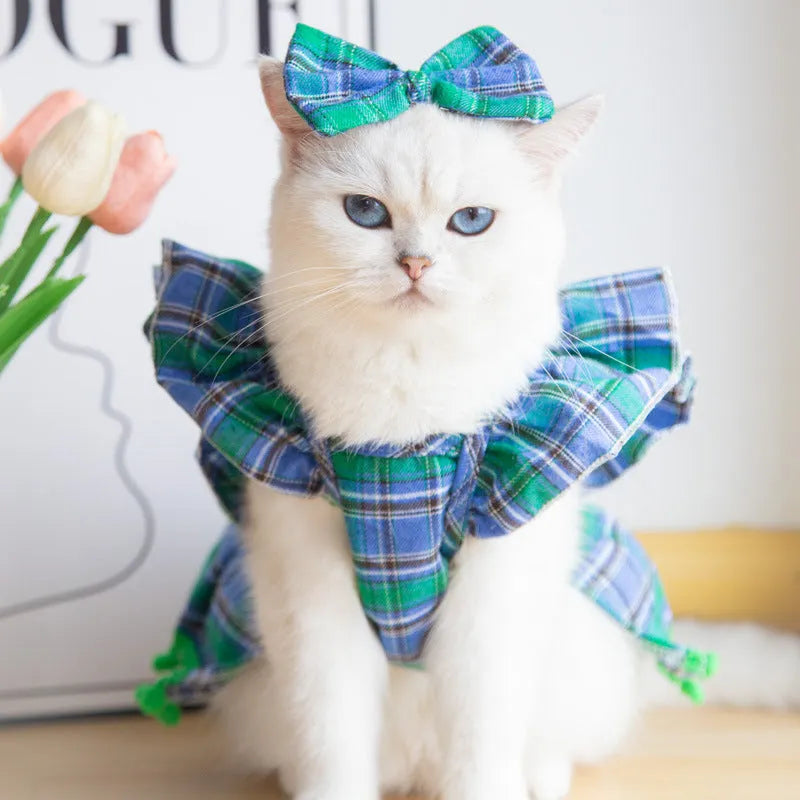 Red tartan Christmas skirt outfit with bow tie and head flower on a small dog or cat.