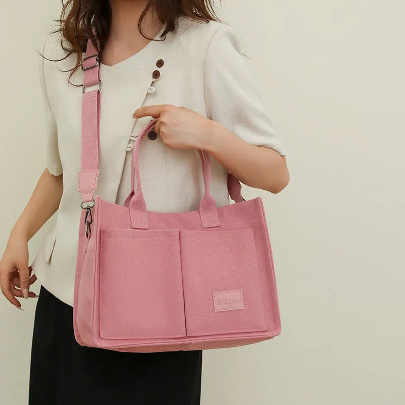 Large casual canvas tote shoulder bag for women with multiple pockets in creamy white