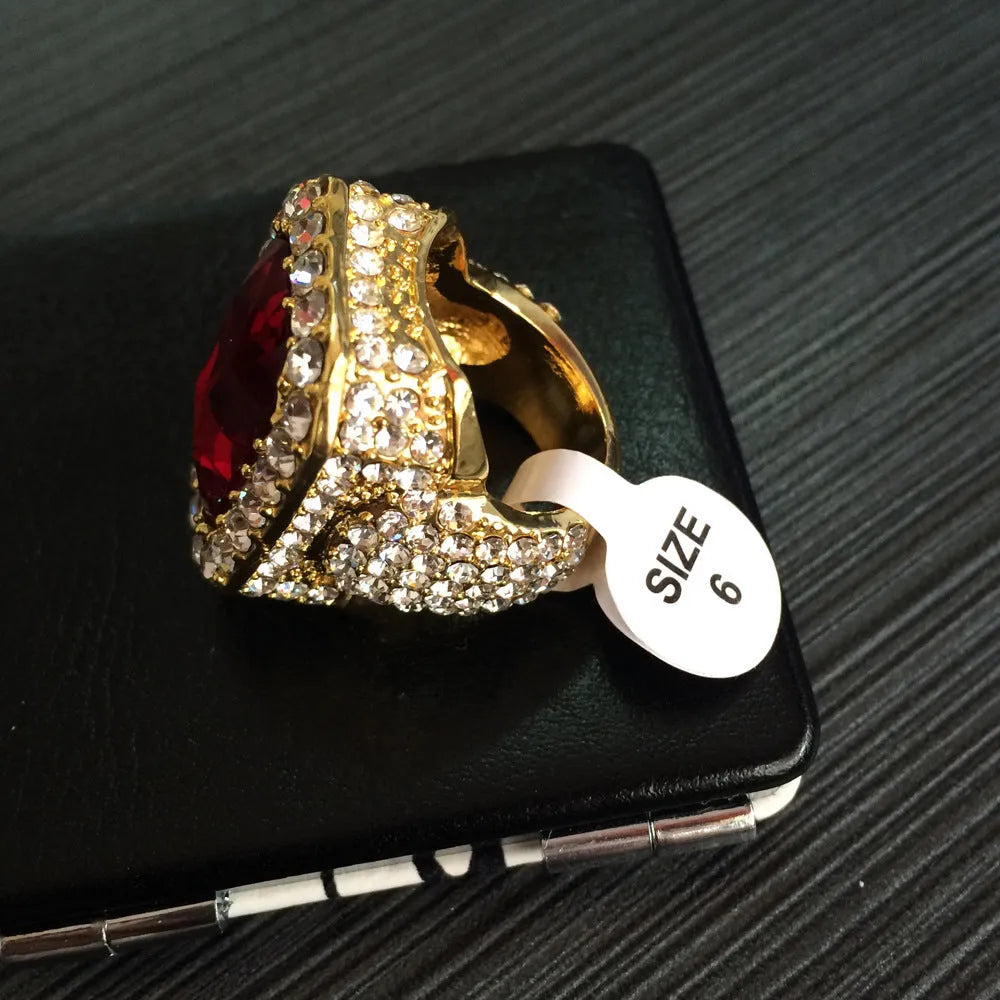 Gold-plated men's hip hop ring with emerald colour, geometric asymmetric design, and diamond treatment