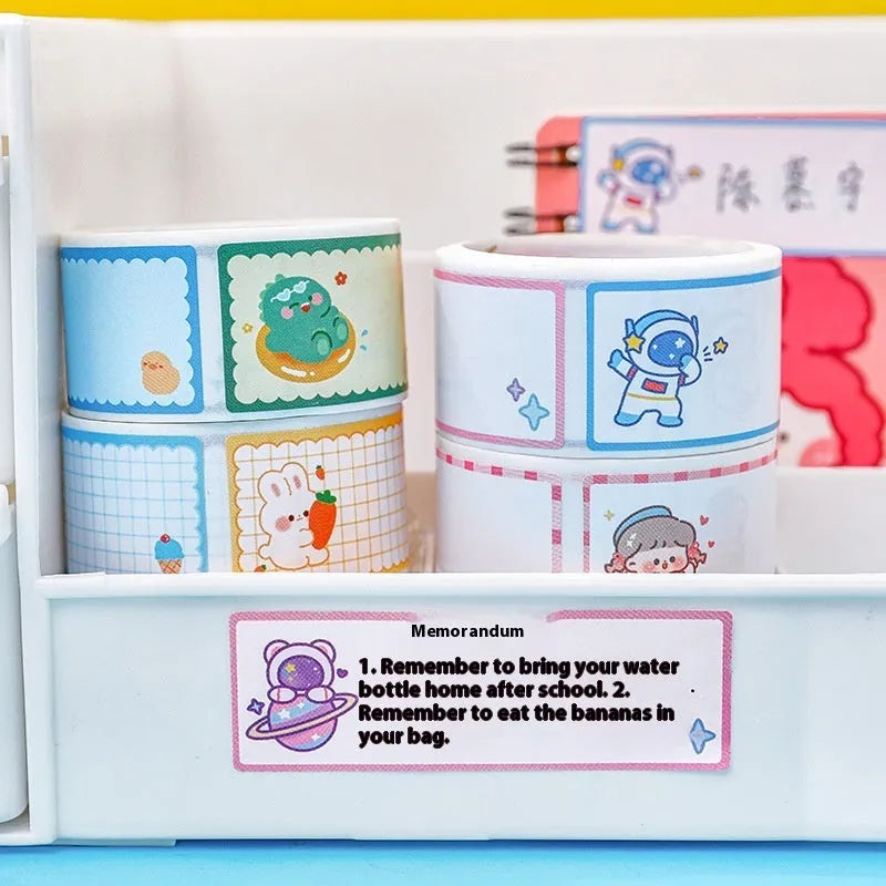 Roll of 60 colourful cartoon name stickers featuring dinosaur, astronaut, rabbit, and girl character designs