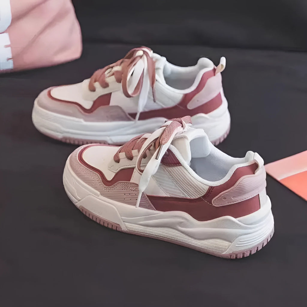 Women's beige and pink low-top rubber sole sneakers on a white background