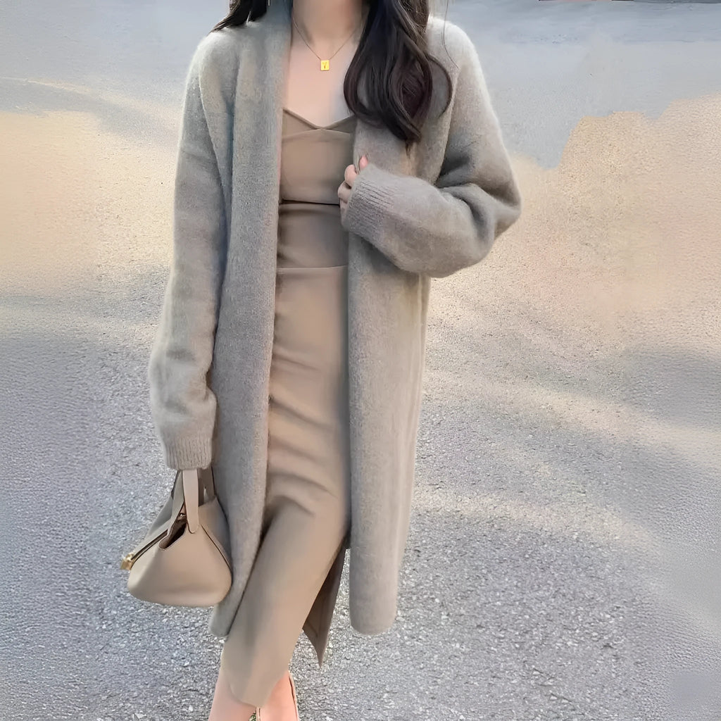 Women's loose fit grey knitted V-neck cardigan coat with long sleeves, shown mid-length.