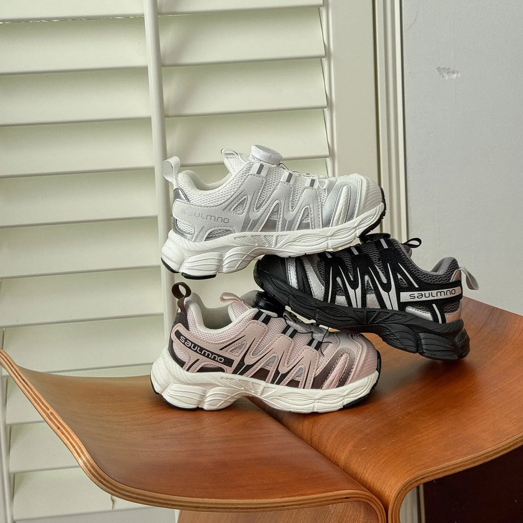 Girls' casual shoes in beige, black, or pink with a breathable PU leather mesh upper.