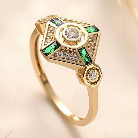 Square geometric emerald diamond ring for women with a green zircon stone on a finger.