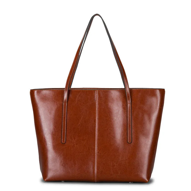 Women's soft cowhide leather shoulder bag in retro brown colour showing external slit pocket and single strap.