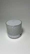 A9 Mini Cracked Bluetooth speaker in white with cracked-effect finish and LED lights