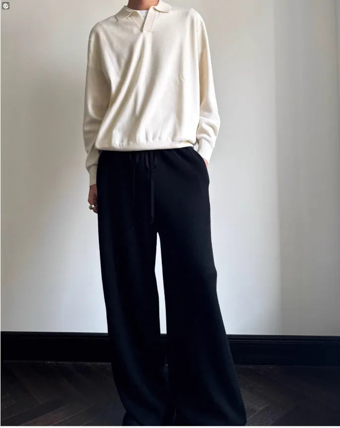 Man wearing a milky white pure wool polo collar sweater with a lapel design.
