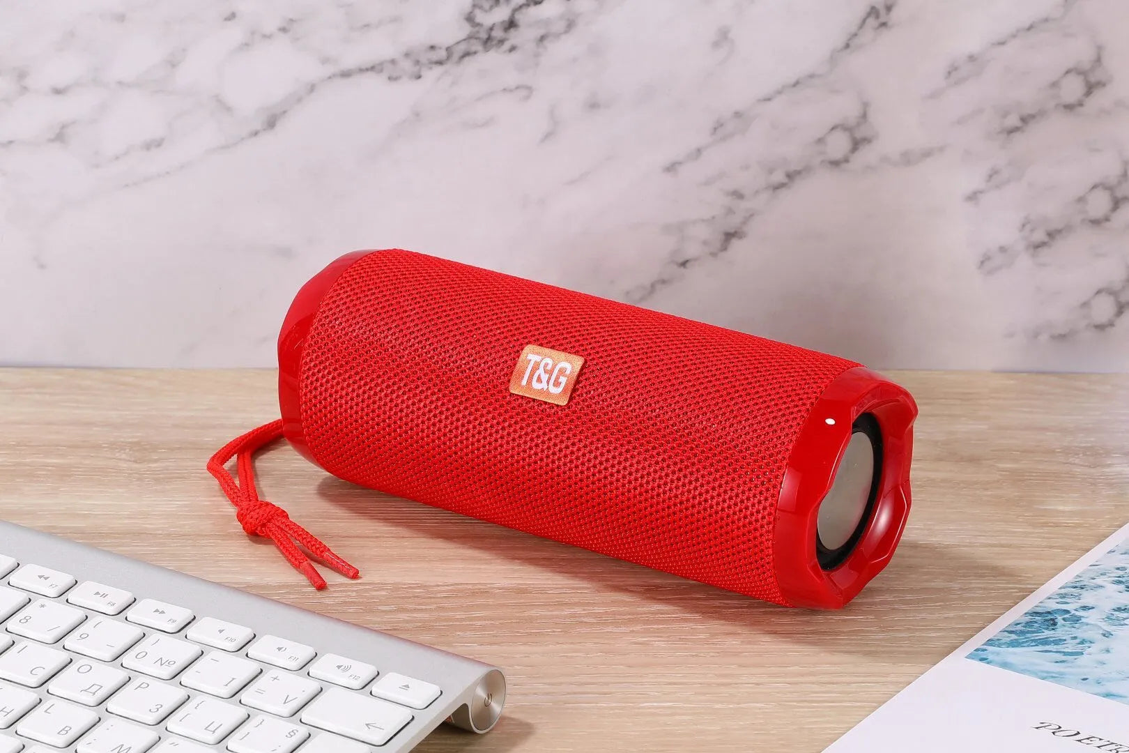 Fabric-covered portable Bluetooth speaker with card slot in camouflage colour.