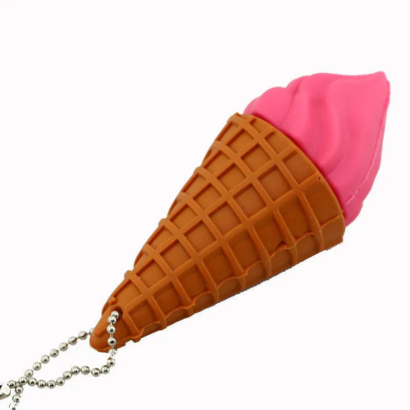 Mini ice cream shaped USB flash drive in pink colour on a plain background.