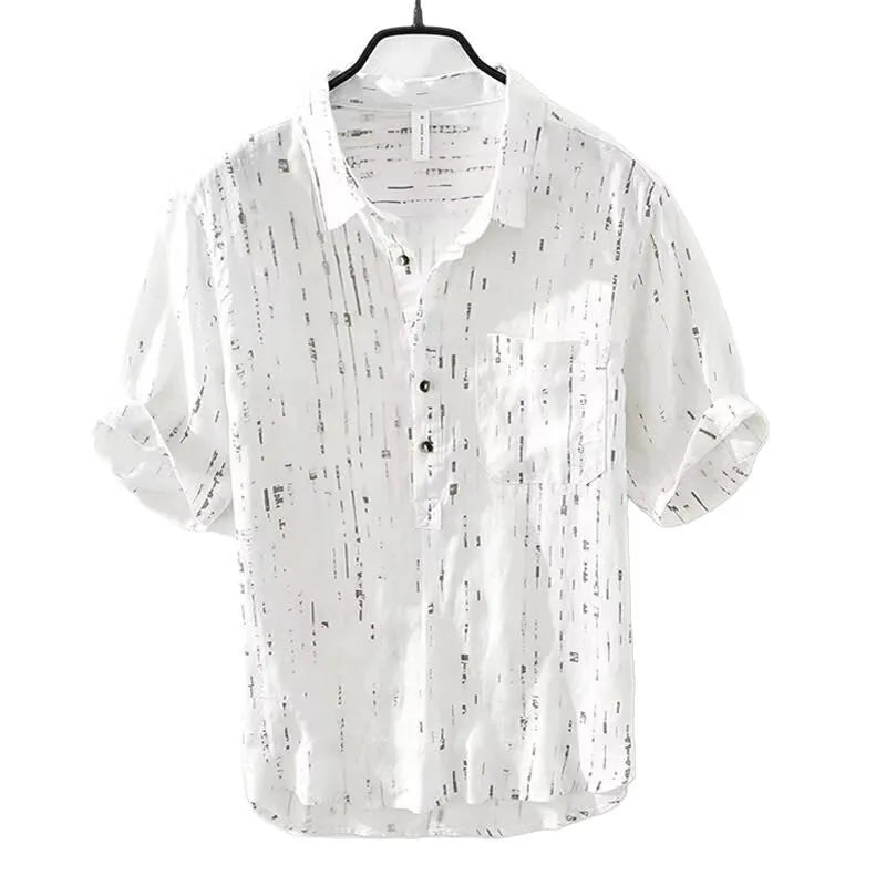 Man wearing a black loose-fit lapel polo shirt, short sleeves, casual summer style.