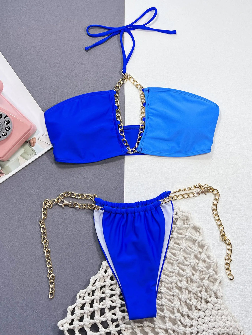 Solid blue women's split bikini swimsuit on a white background