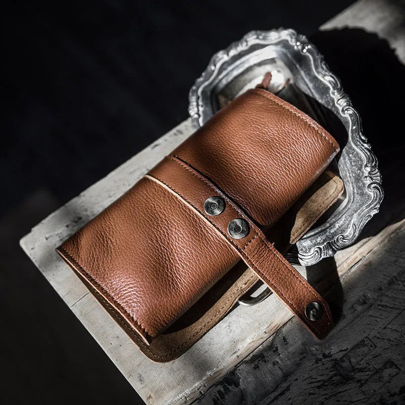Handmade cow leather wallet in black or dark brown with tape extraction closure
