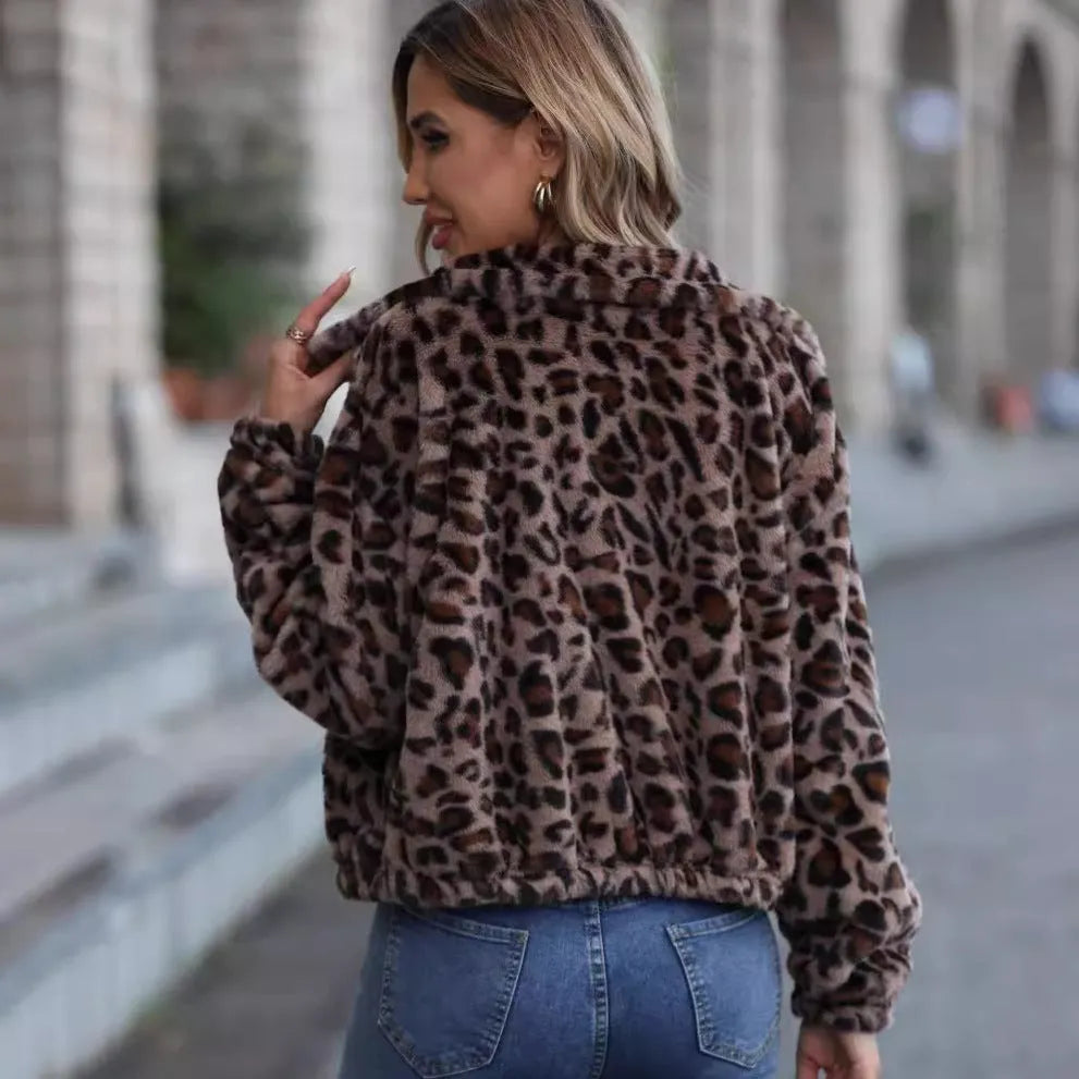 Women's loose leopard print plush coat with front zip and raglan sleeves.