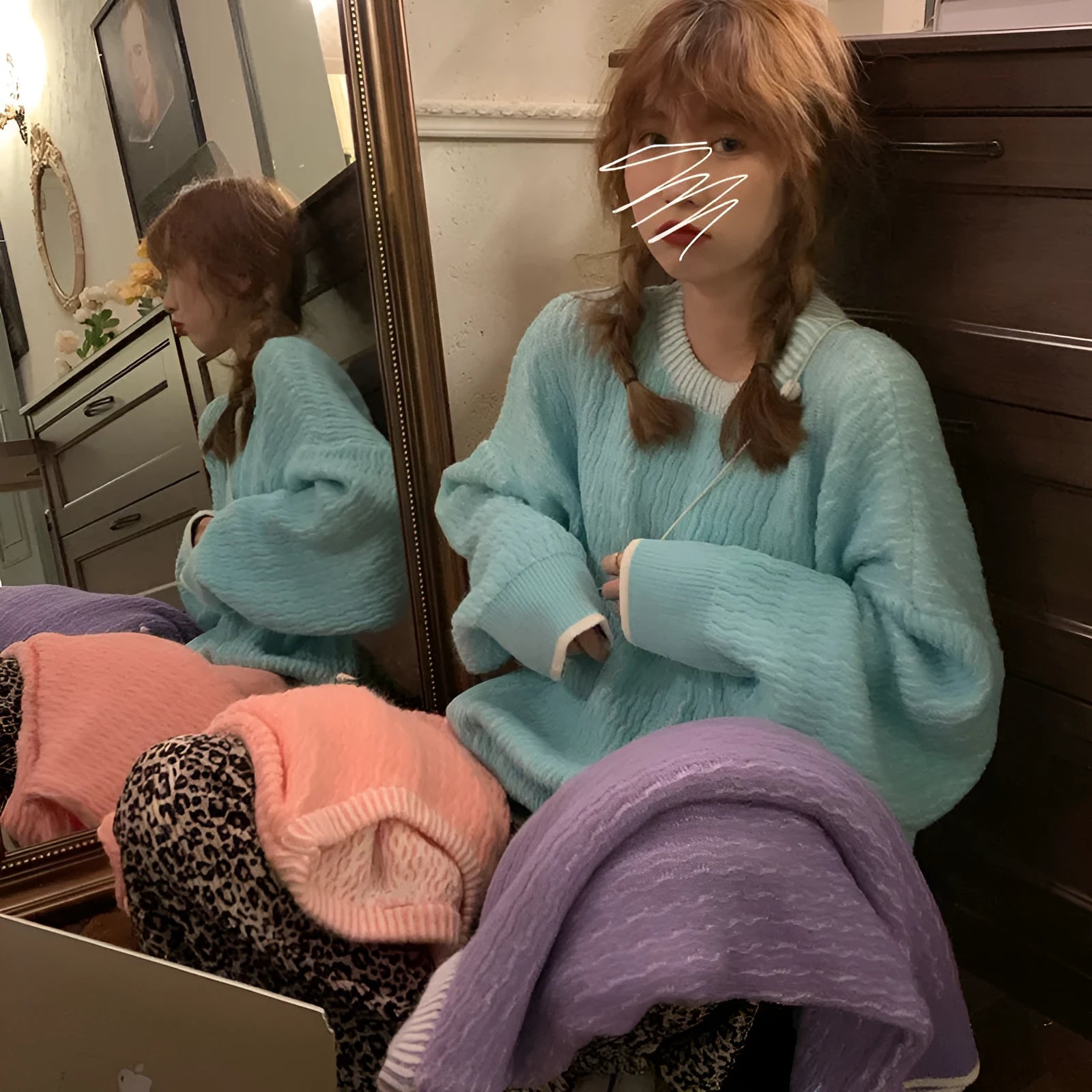 A woman's loose-fitting solid colour pullover sweater in a retro style, shown in a choice of colours.