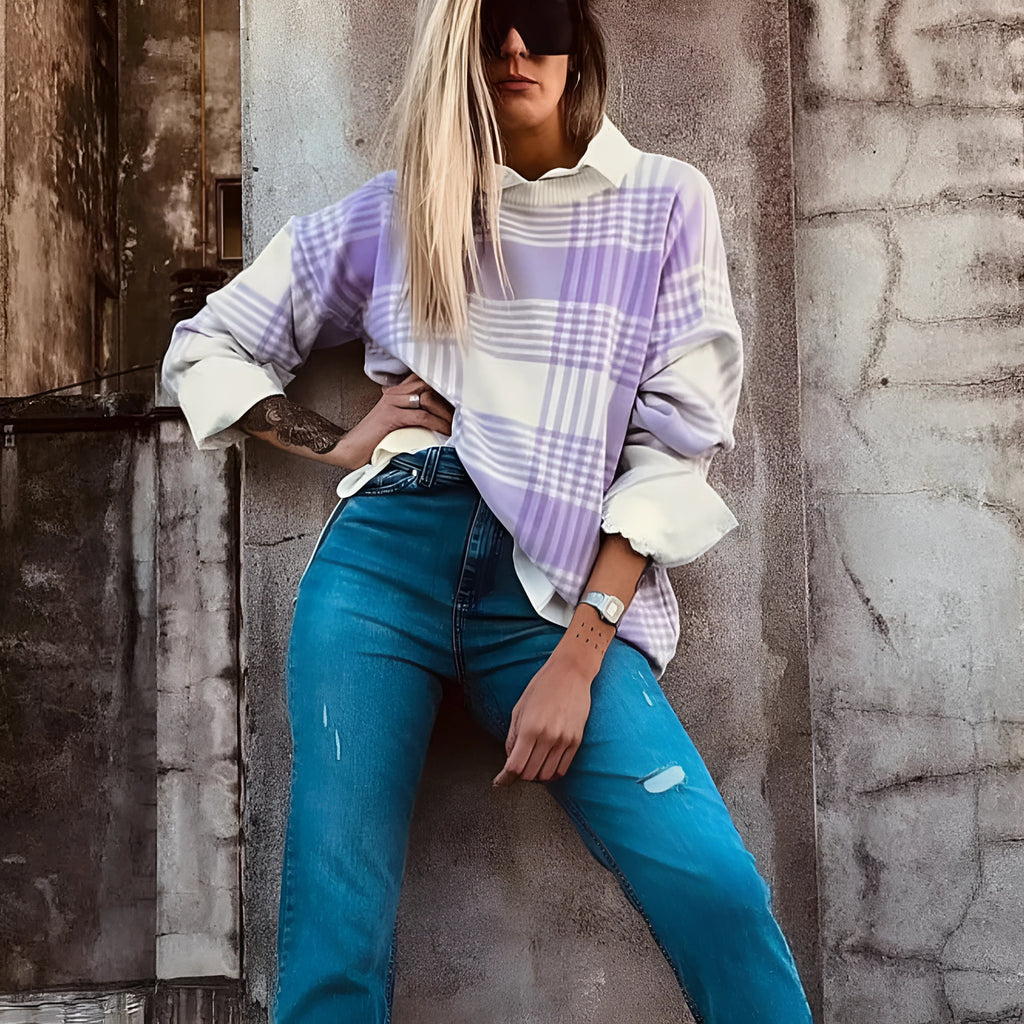 Lilac and white plaid print loose sweater with long sleeves and ribbed trim on cuffs and hem.