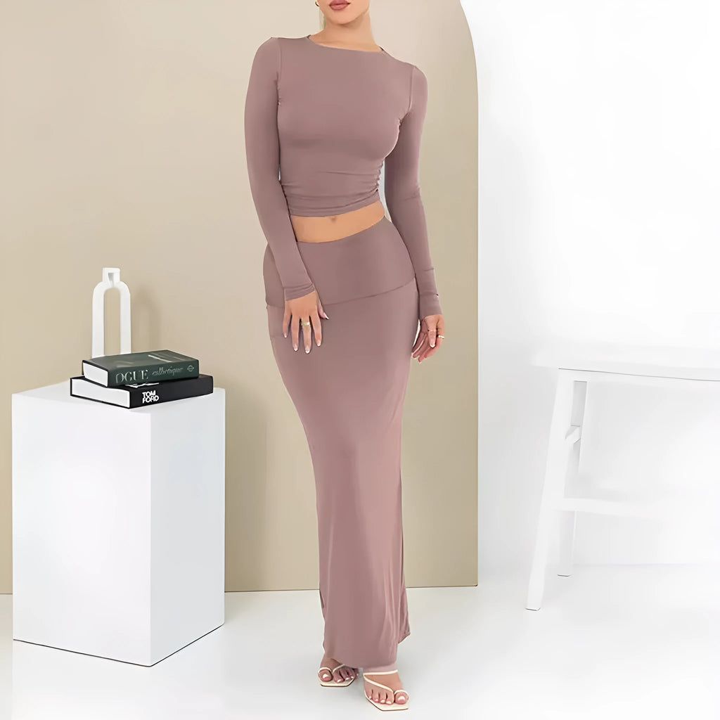 Women's autumn two-piece suit set in polyester, showing slim fit top with three-quarter sleeves and matching long skirt.