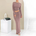 Women's autumn two-piece suit set in polyester, showing slim fit top with three-quarter sleeves and matching long skirt.