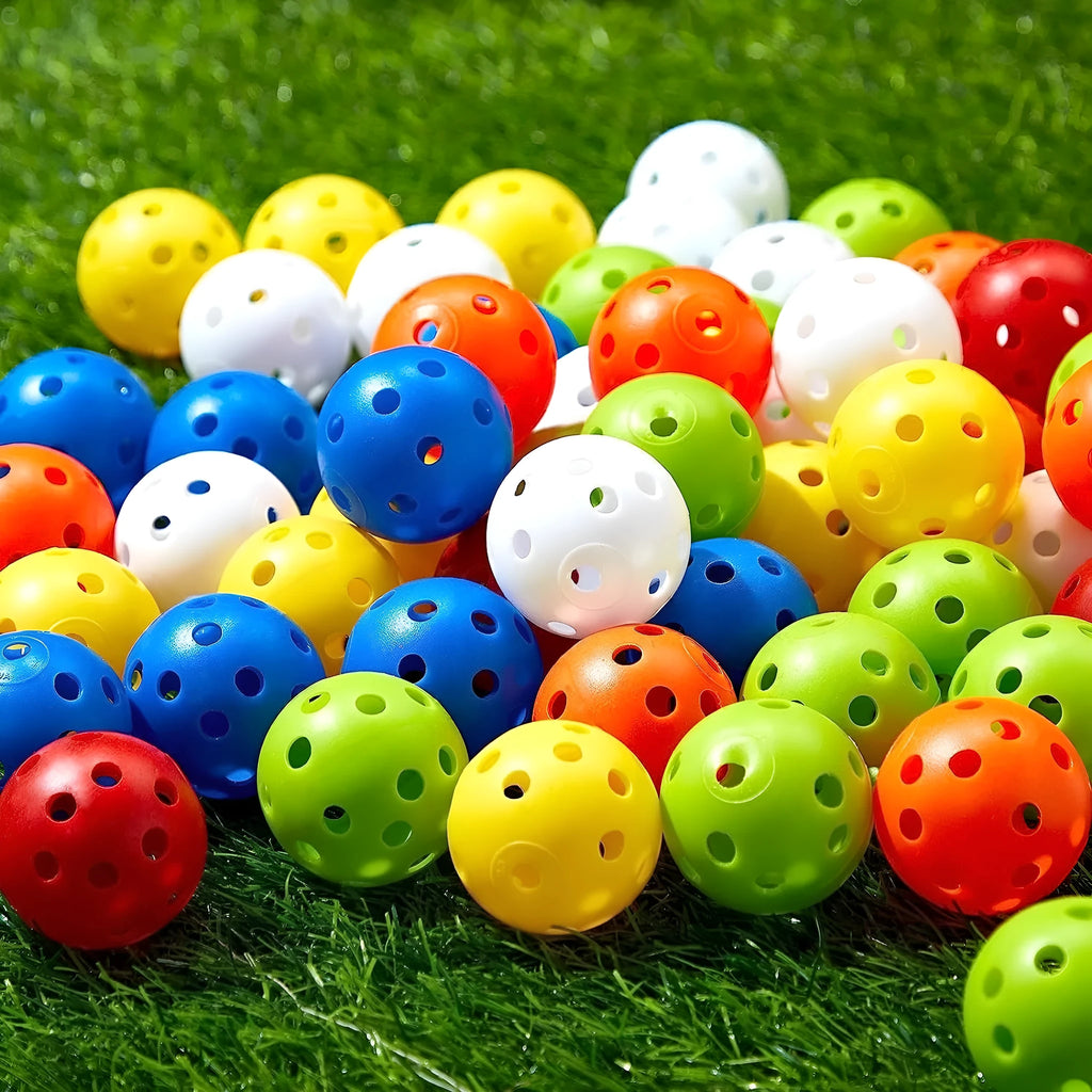 Multi-colour 42mm golf practice balls with a 26-hole surface design in a net pocket.