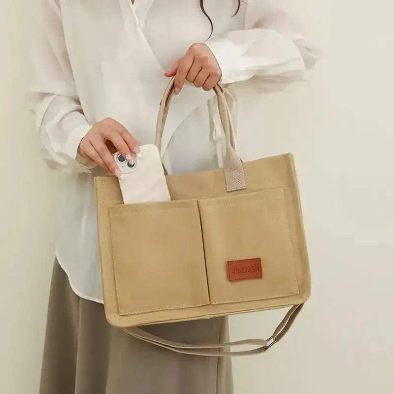 Large casual canvas tote shoulder bag for women with multiple pockets in creamy white