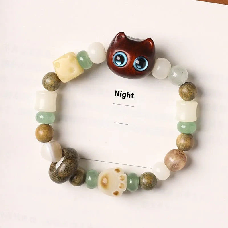 Hand-woven bracelet with sugar cat's paw design combining bodhi seed, jade and ebony wood