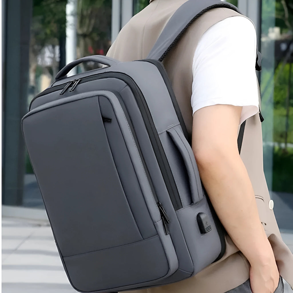 Black or grey waterproof Oxford cloth backpack with 20-35L capacity and curved shoulder straps for business travel