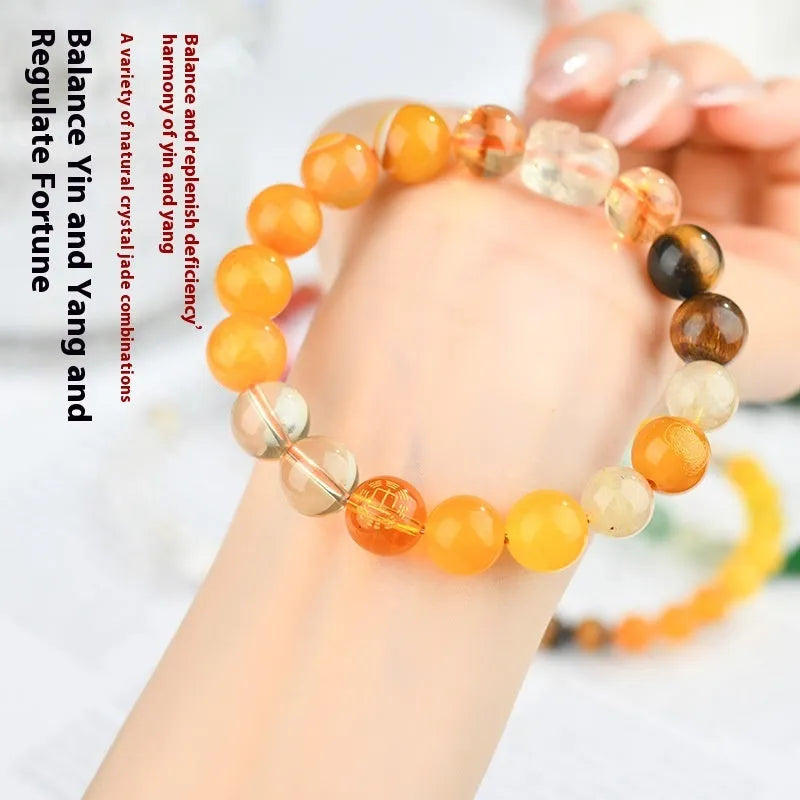 Handmade five elements natural crystal bracelet showing geometric beads in gold, wood, water, fire, and soil colours.