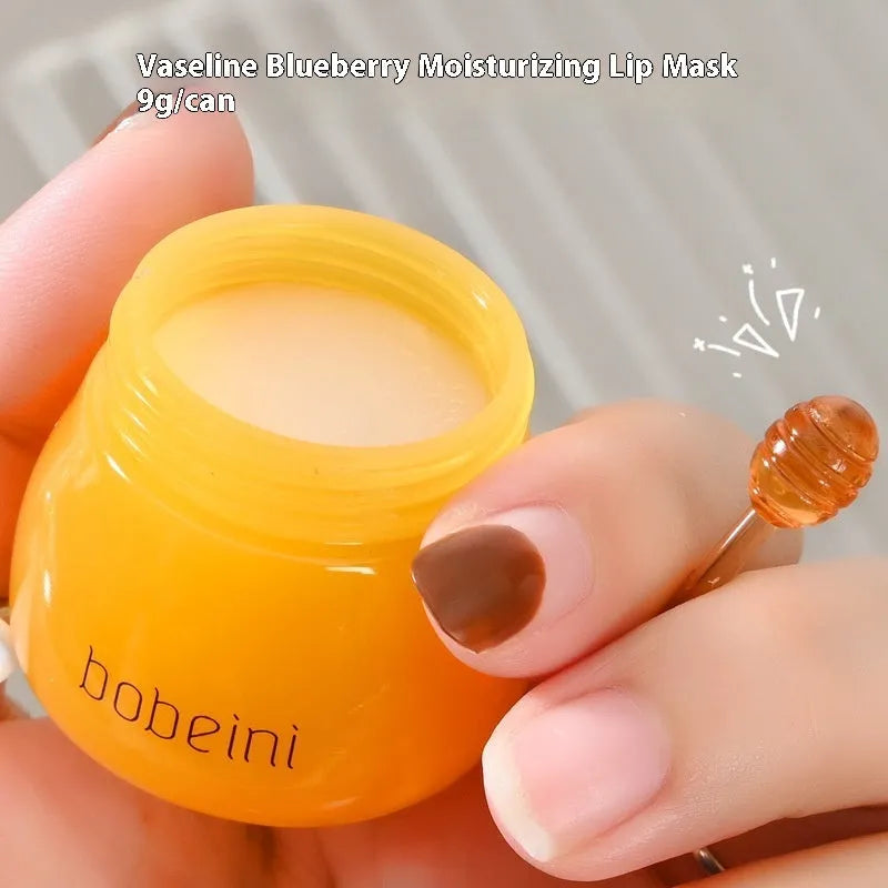 Vaseline moisturising lip balm pot in 9g size with a small brush applicator.