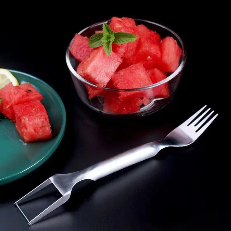 Silver stainless steel watermelon fork slicer with extended handle and rounded fork head