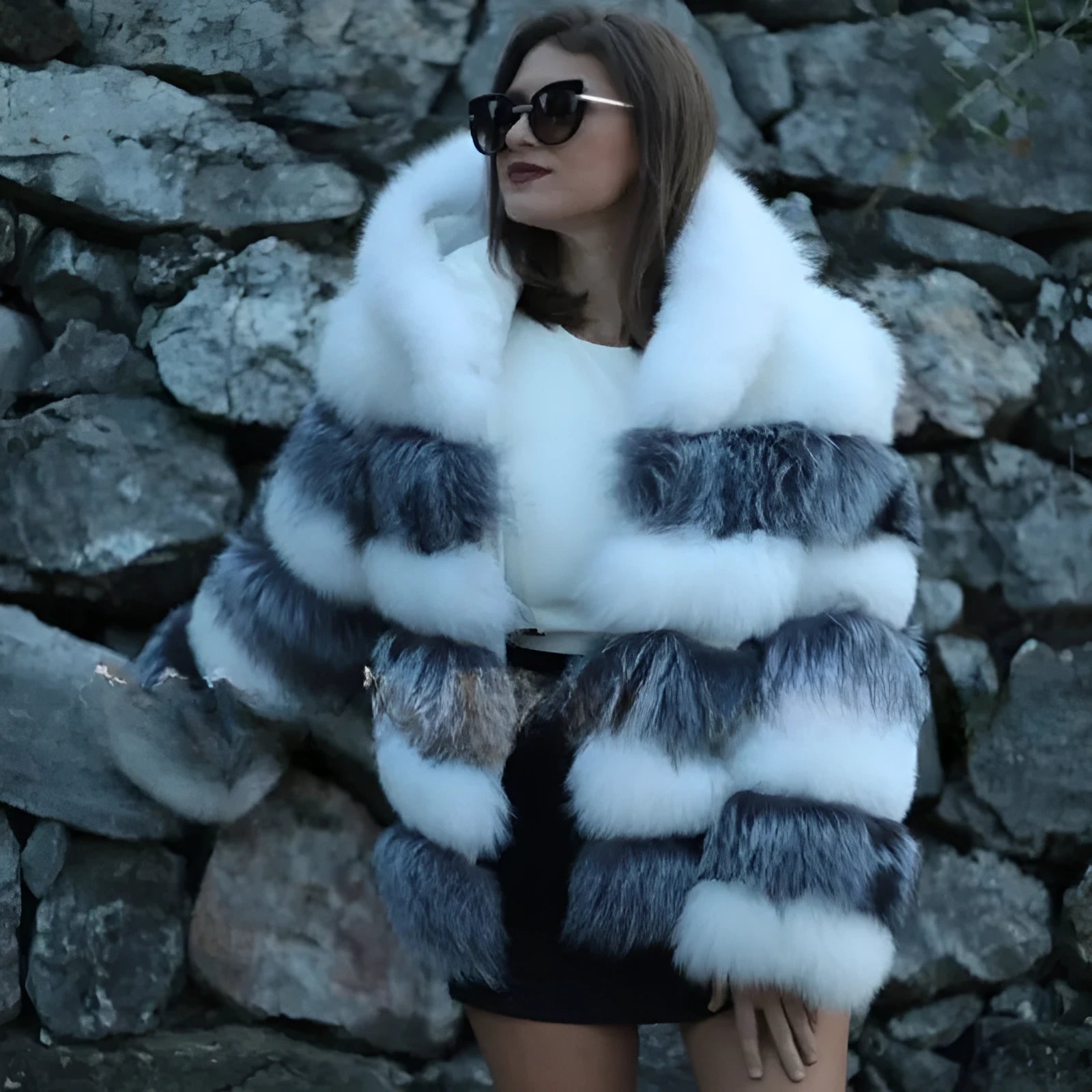 Loose-fitting women's faux fur coat with a hood in brown, shown in streetwear style.