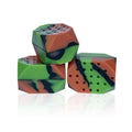 Two camouflage silicone facial muscle fitness balls for jaw training in a transparent box.