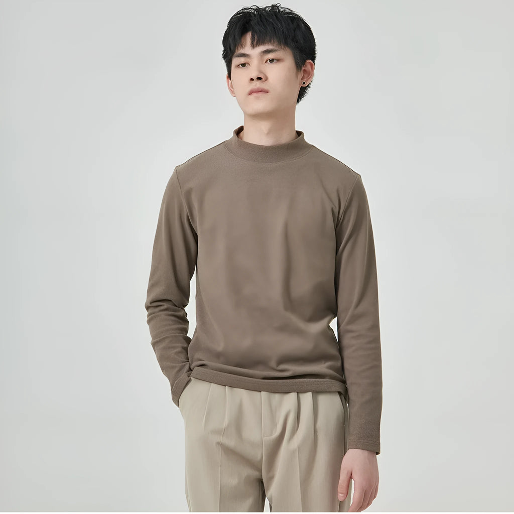 Men's solid colour half-high collar long sleeve t-shirt in Dralon fabric on a hanger.