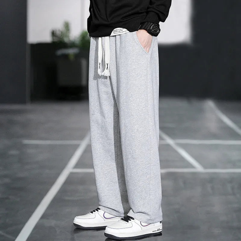 Men's grey casual bamboo fibre trousers with a high waist and multiple pockets.