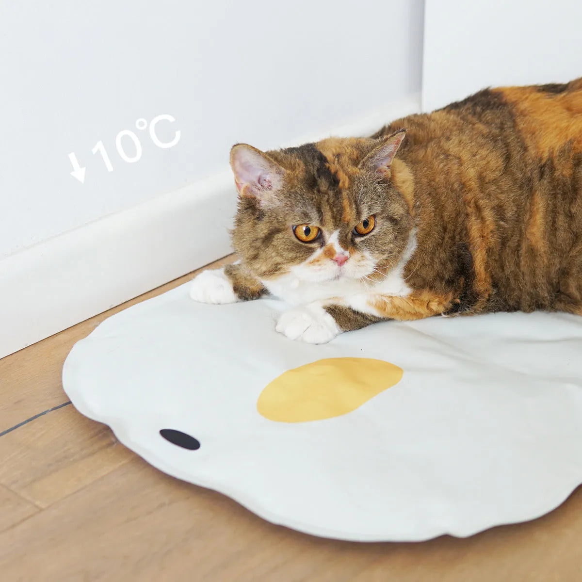 Washable chick-shaped pet cooling mat with non-stick surface next to an oval-shaped option.