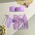 Women's pink tube top swimsuit with large 3D flower tie and matching skirt.