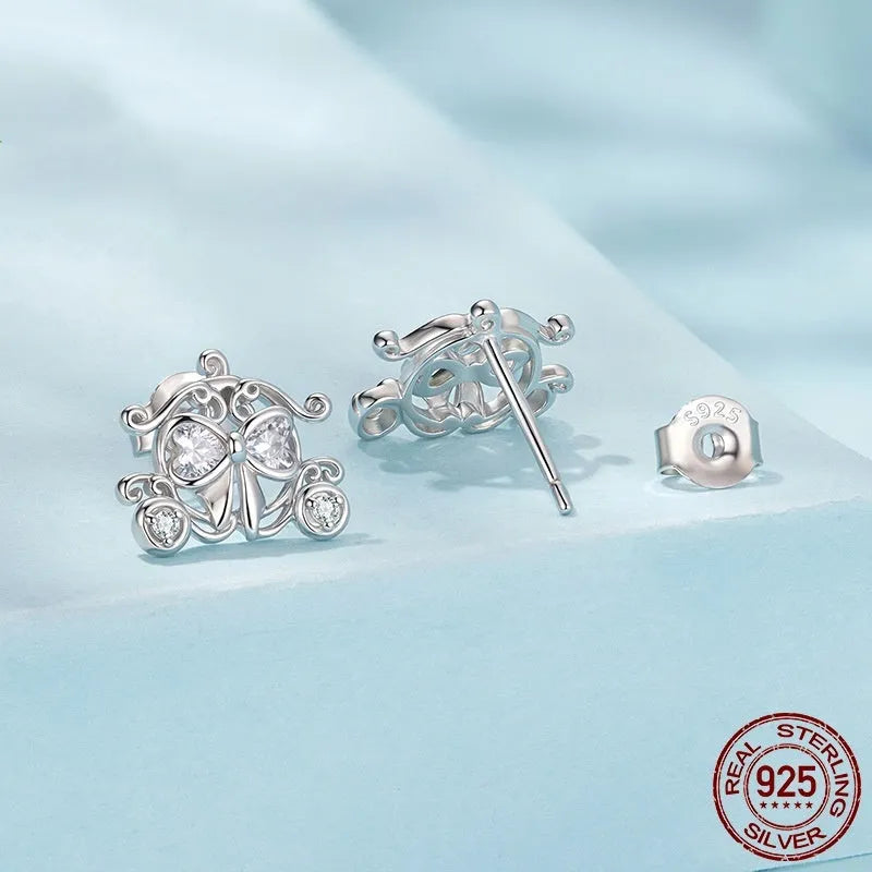 Pair of 925 silver retro pumpkin car stud earrings with romantic French design against a neutral background