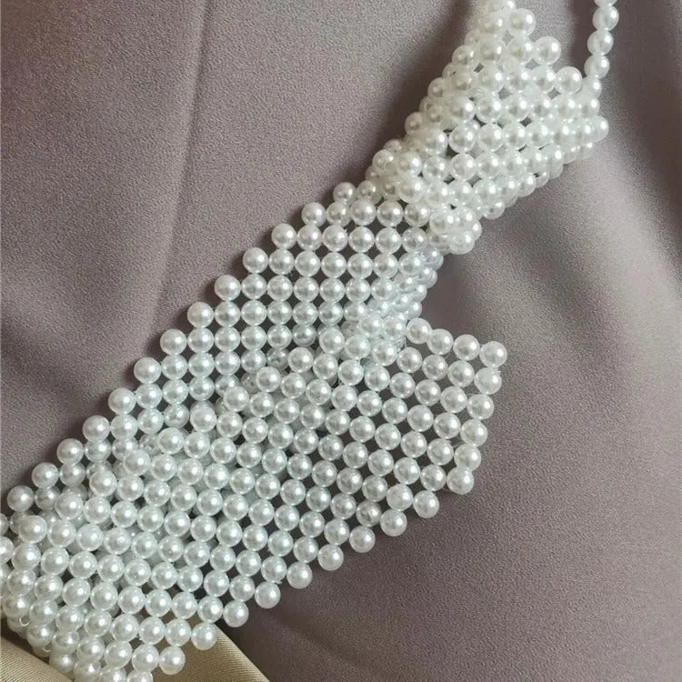 Adjustable pearl body chain with hollow-out design and alloy tie clasp in white or black colour