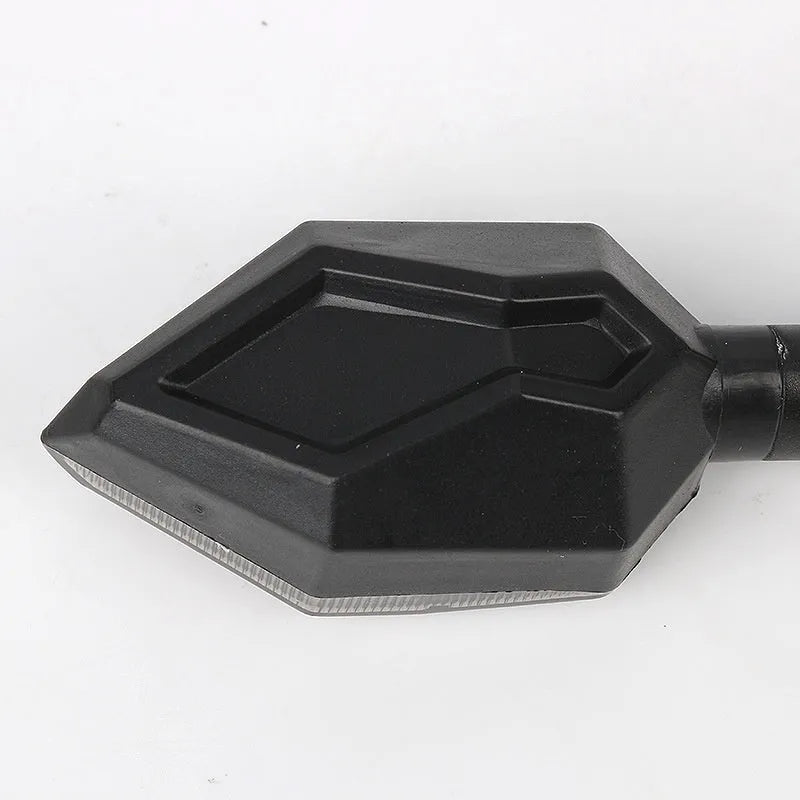 Arrow-shaped 12V LED motorcycle turn signal light in yellow with choice of blue, red, or white accent.
