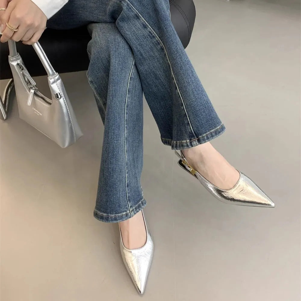 Thin low heel strap pointed leather shoes in black, red, brown, and silver colour options showing rubber soles