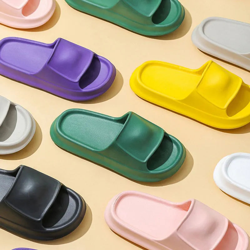 A pair of soft, thick-soled EVA flip-flop slippers in a chosen colour, showing the non-slip tread pattern on the sole.