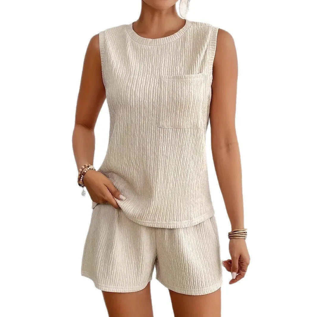 Apricot sleeveless round neck vest and matching shorts set laid flat, showing Asian sizing labels.