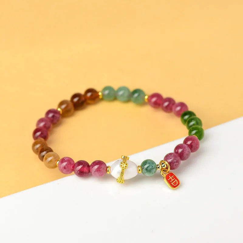Geometric optimised tourmaline bracelet with 6.5mm chalcedony beads in natural crystal