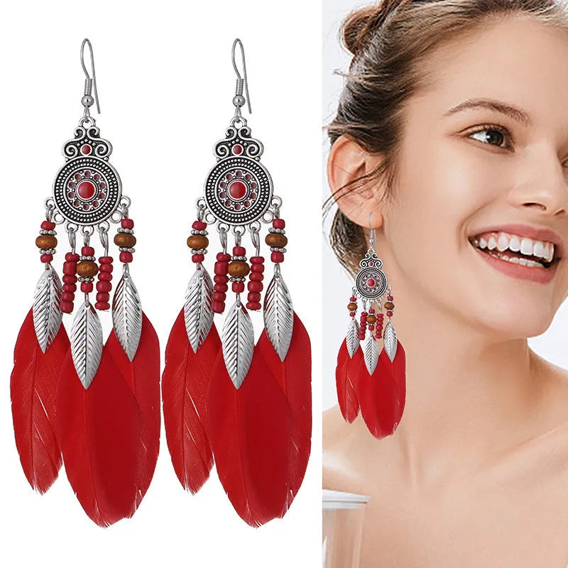 Feather-shaped drop earrings with leaf pattern in thirteen colour options on alloy metal