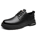 Men's black retro casual leather shoes with artificial PU upper and round toe on a neutral background.