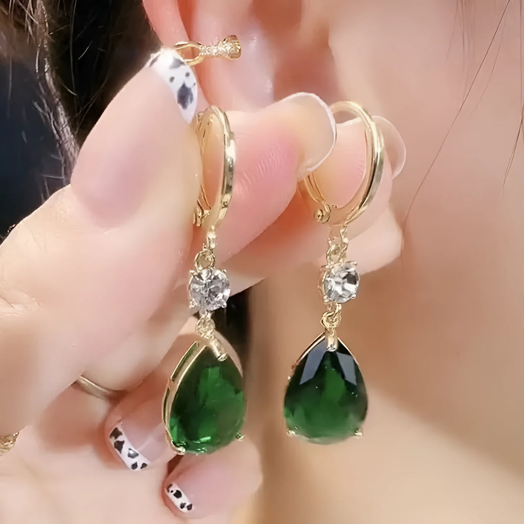 A pair of green geometric teardrop clip-on earrings made from alloy.
