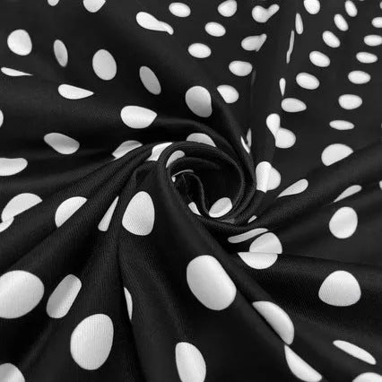 Multicolour polka dot dress with a square collar, short sleeves, front zipper, and pleated skirt.
