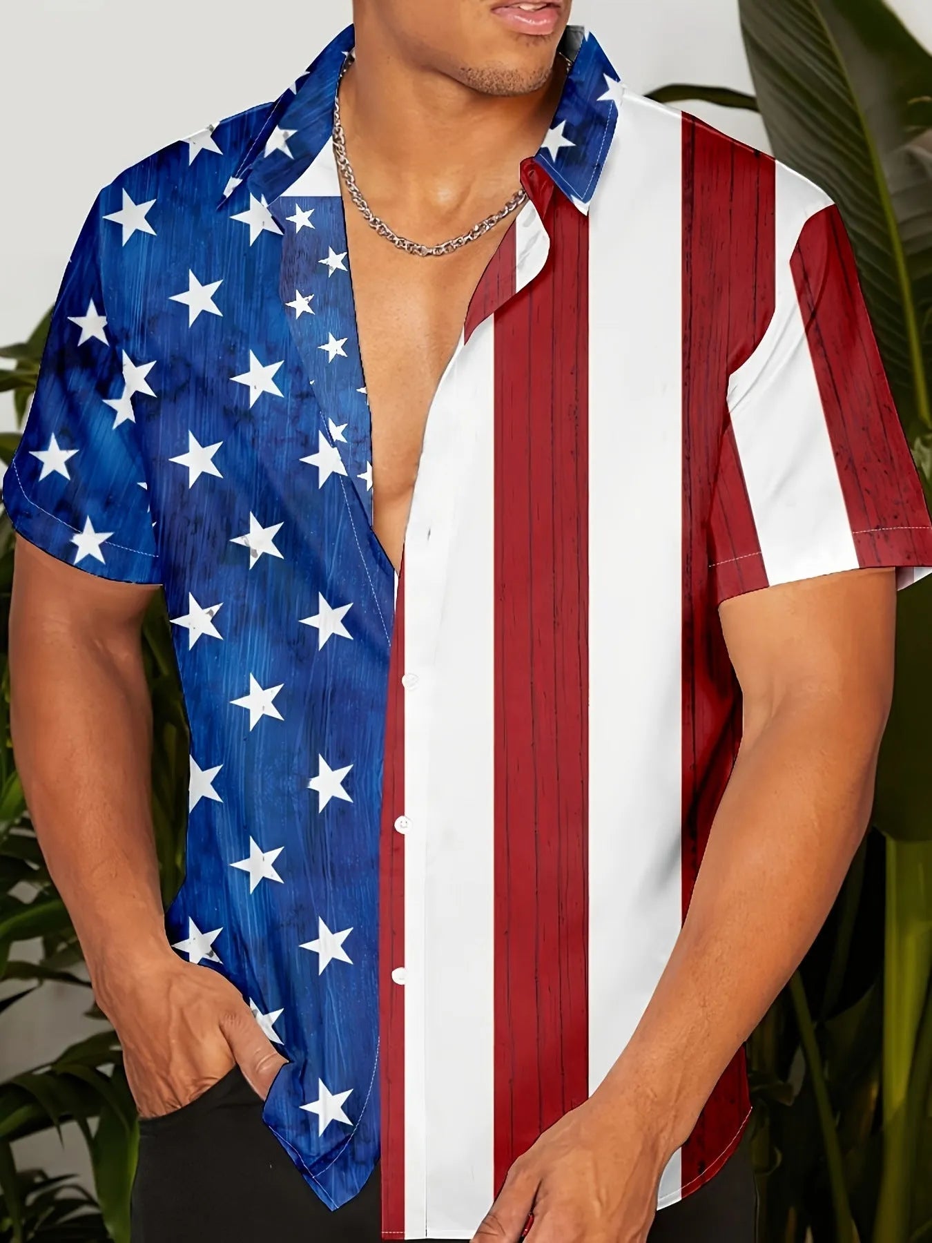 Man wearing a loose-fit floral print short sleeve shirt in a cardigan style.