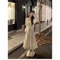 Women's white V-neck knitted dress with long princess sleeves and suspender skirt silhouette