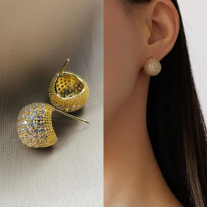 Geometric drop-shaped earrings with golden beans ear clip design in gold and white colours
