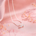 925 silver cherry pendant necklace with an adjustable snake bones chain on a white background.