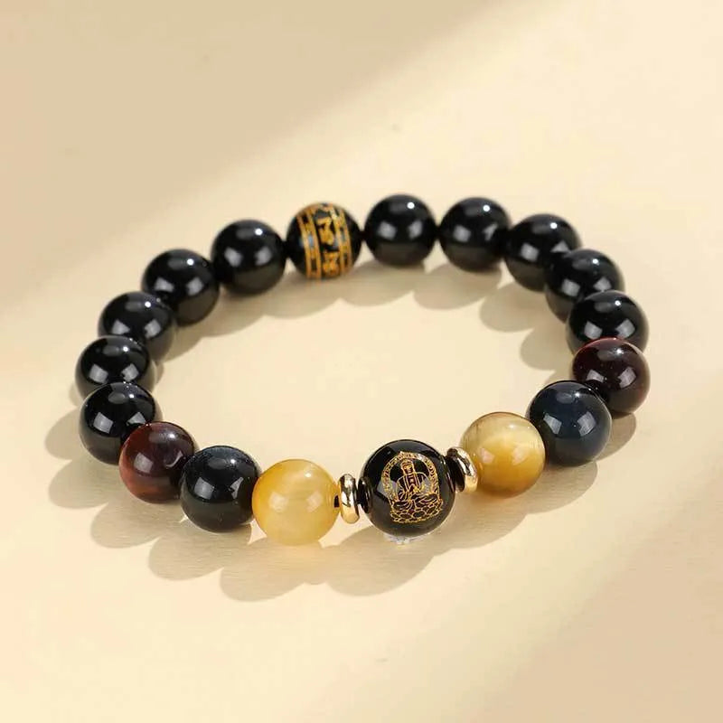 Handmade black agate bracelet with zodiac animal charms and gold tiger eye beads on wrist